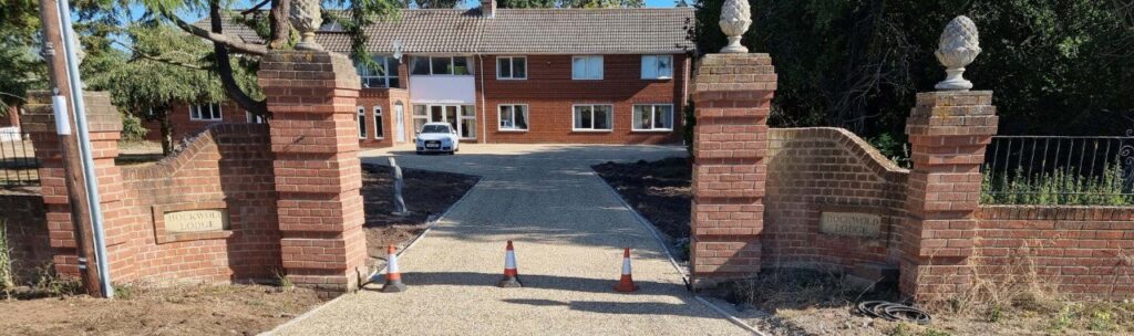 This is a photo of a newly installed chip and tar driveway, installed by Great Shelford Driveways
